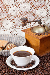 cup of coffee and roasted beans