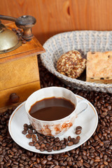 cup of coffee and roasted beans
