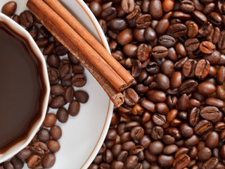 cup of coffee and roasted beans