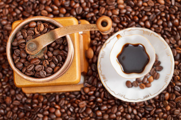 cup of coffee and roasted beans