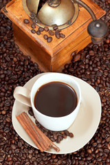 cup of coffee and roasted beans