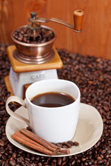 cup of coffee and roasted beans