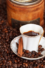 cup of coffee and roasted beans