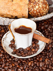 cup of coffee and roasted beans