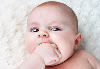 Baby with fist in mouth