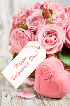 Gift box in the shape of hearts and pink roses with label