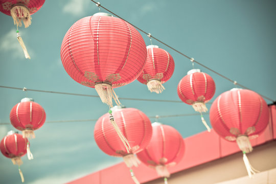 Red Chinese Paper Lanterns Against A Blue Sky