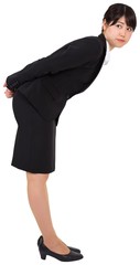 Serious businesswoman bending