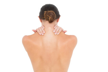 Naklejka premium Close-up rear view of a topless woman with shoulder pain