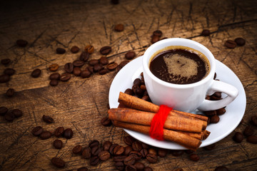 Cup of coffee with cinnamon rolls