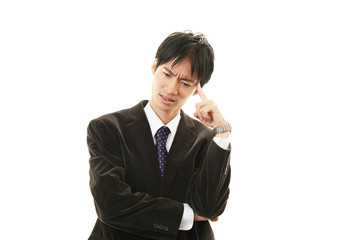 頭痛を訴えるビジネスマン