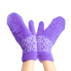 Hands in fluffy lilac mittens