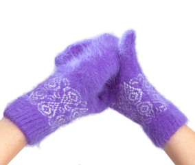Hands in fluffy lilac mittens