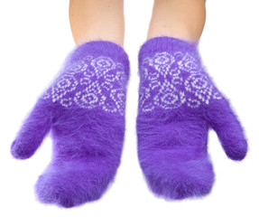 Hands in fluffy lilac mittens