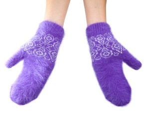 Hands in fluffy lilac mittens