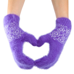 Hands in fluffy lilac mittens