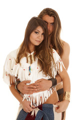 couple long hair man behind Native American woman looking