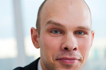 Handsome businessman with raised eyebrow