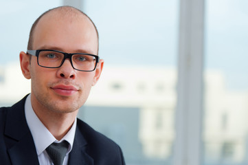 Fototapeta premium Young smiling businessman