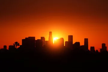 Wandcirkels aluminium De zonsopgang van de de stadshorizon van Los Angeles. © logoboom