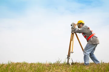 Foto op Canvas Surveyor engineer making measure on the field © Tom Wang