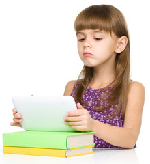 Young girl is using tablet