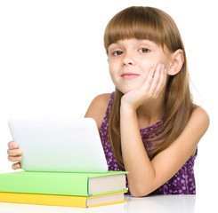 Young girl is using tablet