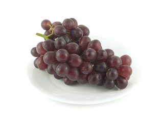 Red wine grape branch with tasty berries on plated isolated