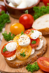 ciabatta with mozzarella and colorful cherry tomatoes, close-up