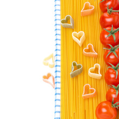 spaghetti, pasta in the form of hearts and cherry tomatoes