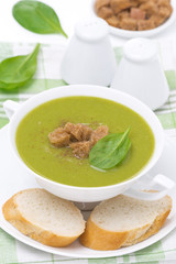 spinach soup with croutons in a bowl