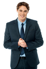 Corporate guy posing with clasped hands