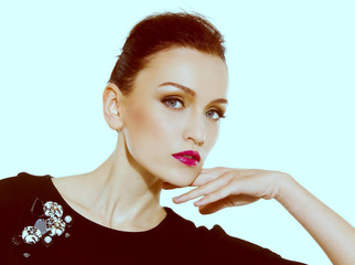 face of brunette woman with fashion makeup and red lips