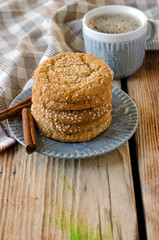 Cookies on a wooden table with a cup of coffee