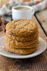 Cookies on a wooden table with a cup of coffee