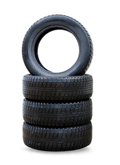 Stack of four wheel new black winter tyres for car