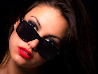 Portrait of the beautiful girl with sunglasses