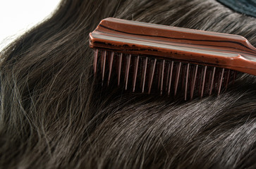 Obraz premium Comb, hairbrush and hair on white background