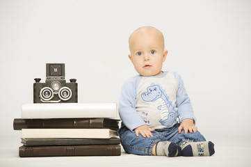 little boy with a film camera