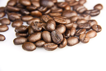 Brown coffee beans isolated on white background