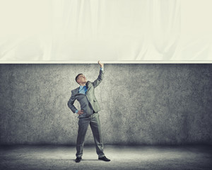 Young man pulling banner