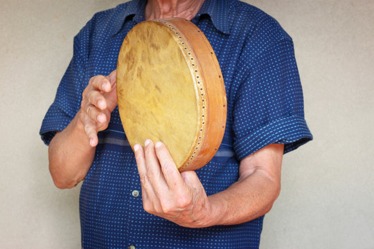 Senior Musician Playing Ethnic Drum.