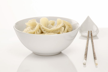 Chinese dumpling served on a white plate