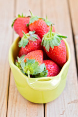 Fresh strawberry over wooden background