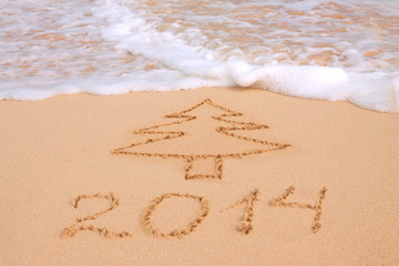 Fototapeta premium Year 2014 written in sand on tropical beach 