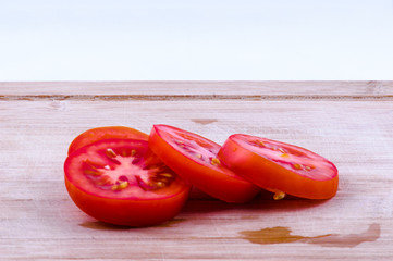 chopped tomatoes on chopping board closeup