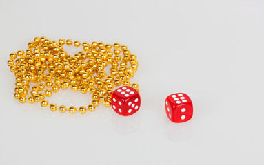 red dice and gold beads © geniuskp