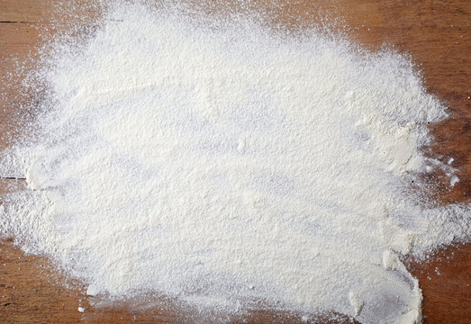 white flour on wooden table