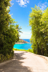Road to the turquoise ocean and beach in the Seychelles