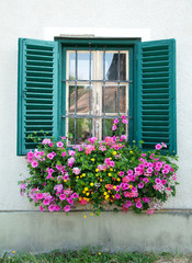 wooden window decorated with flowers - 59370382